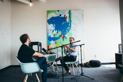 two men walking on a podcast