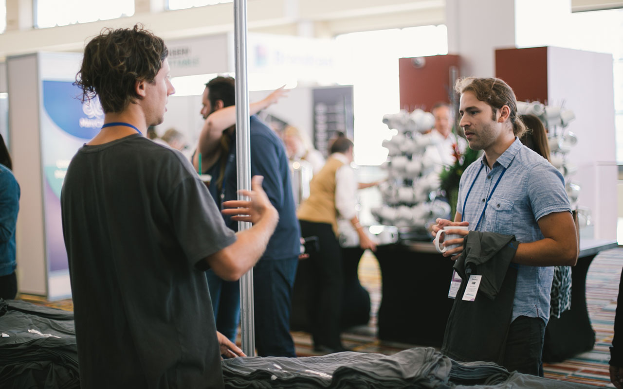 rob explaining screen printing to customer 