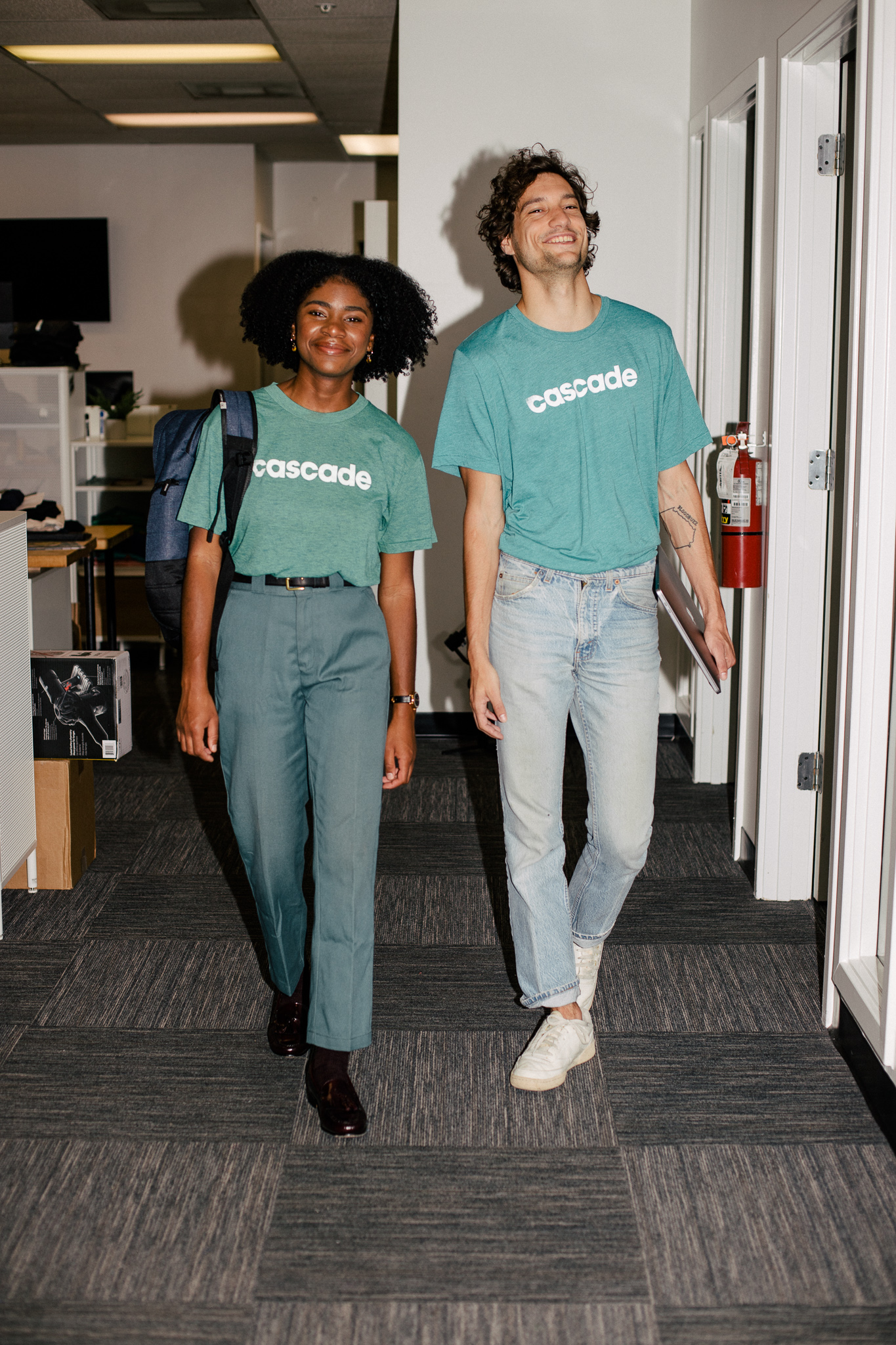 Happy staff wear custom work shirts