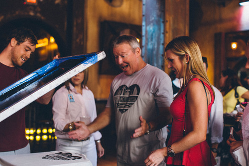 four people screen printing