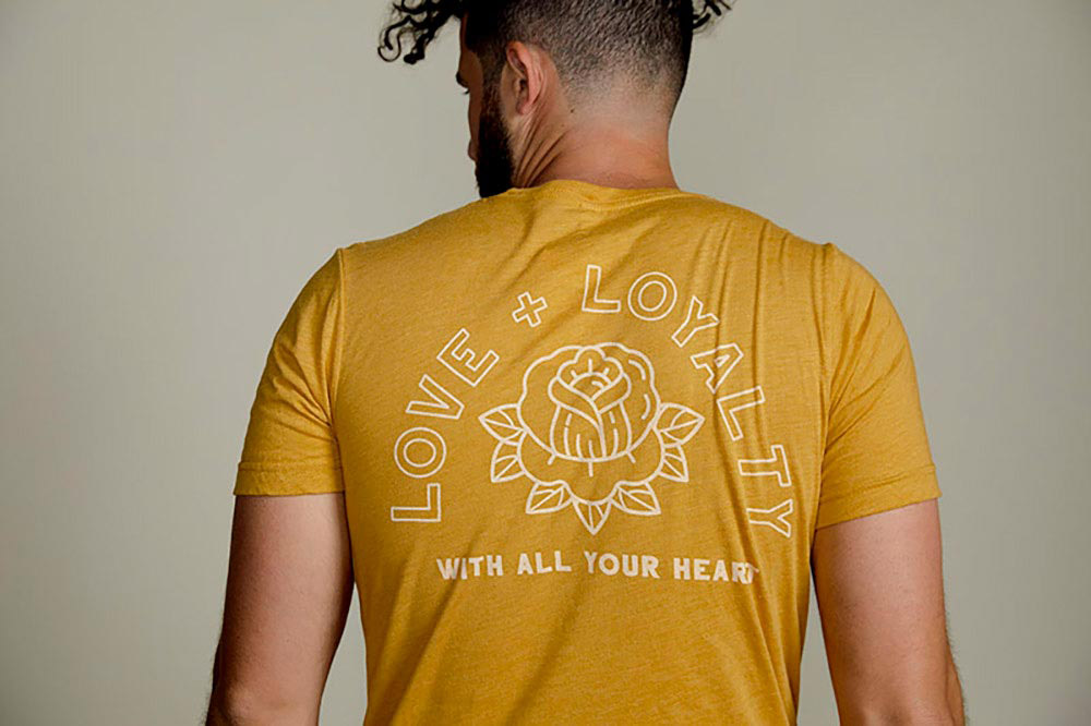 man wearing yellow shirt facing his back