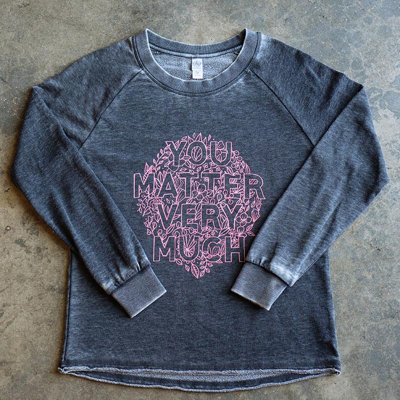 grey shirt with pink graphic 
