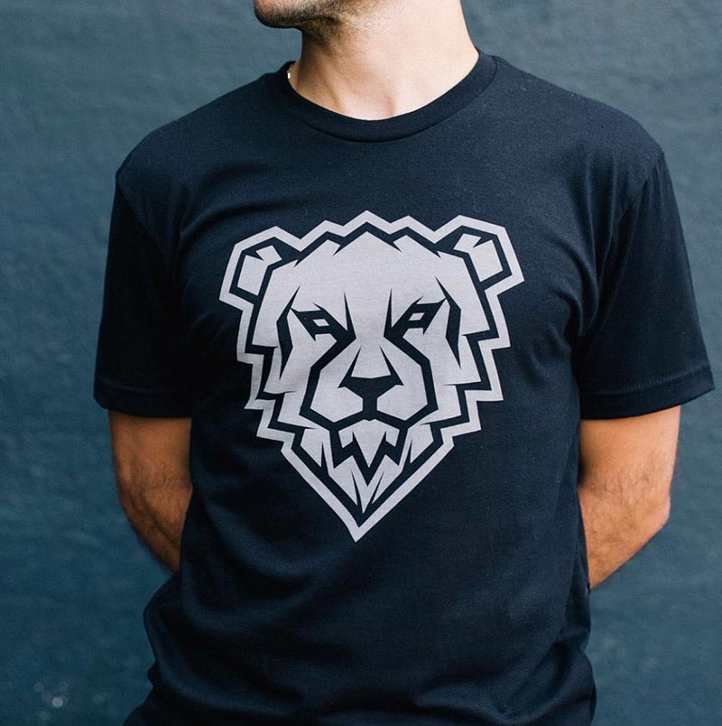 man showing black shirt with white bear graphic