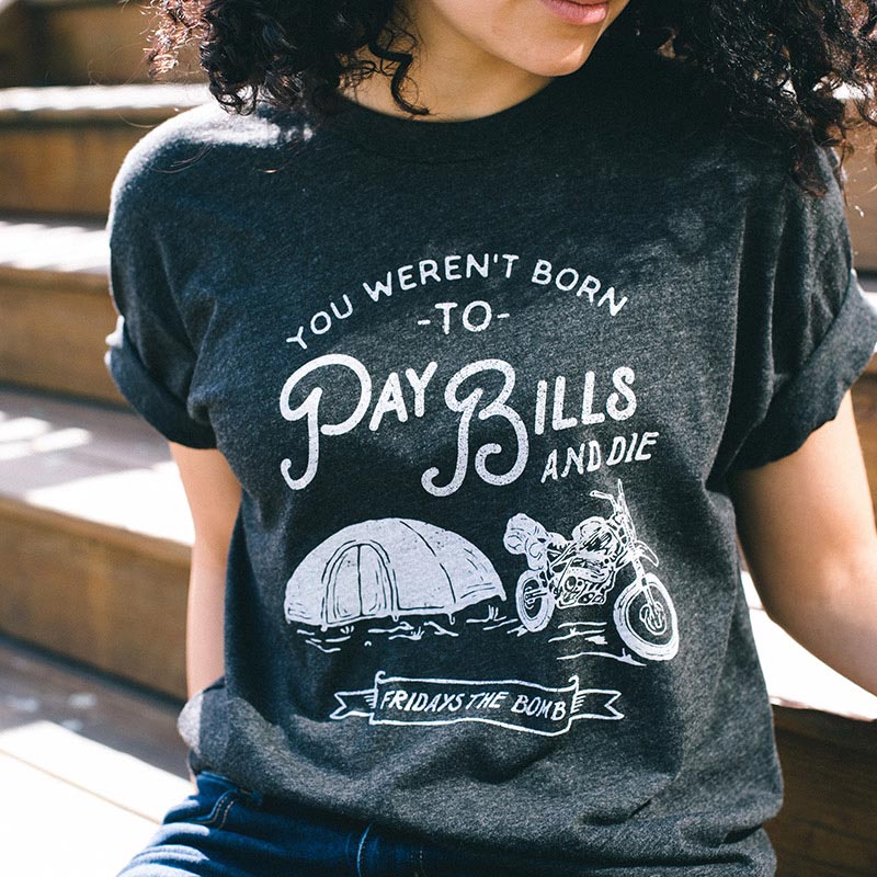 girl modeling grey shirt with white graphic