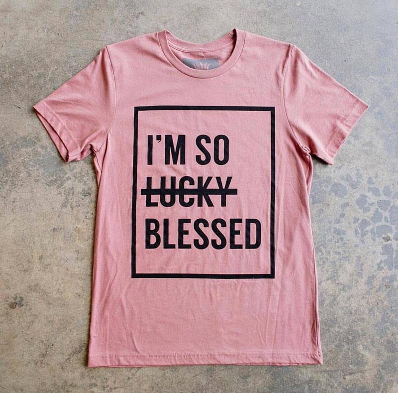 pink shirt on ground