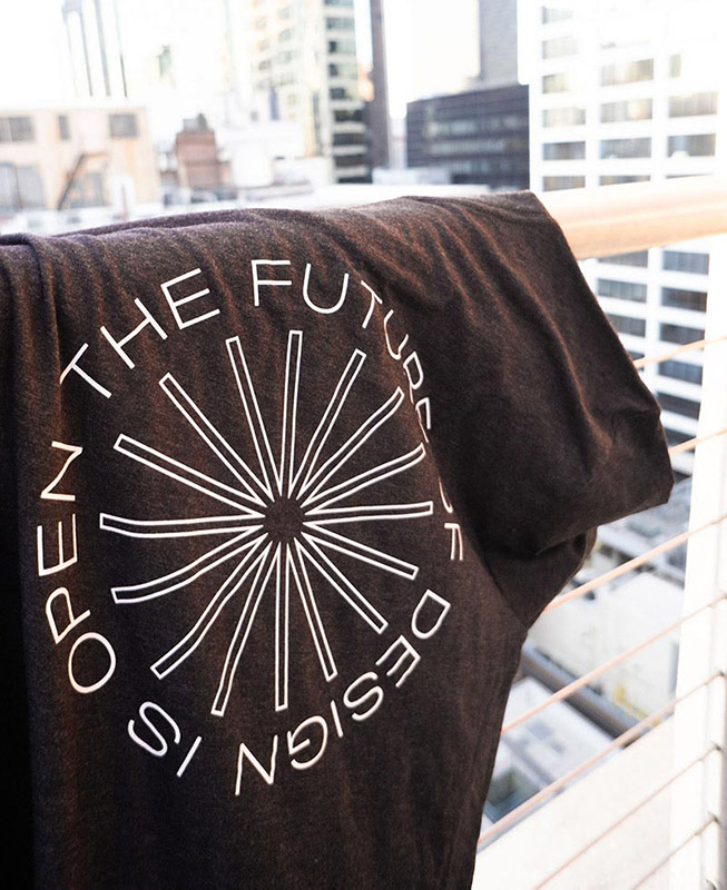 black shirt hanging over railing