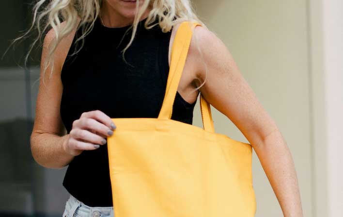 Woman with yellow custom tote bag