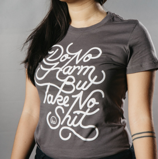 woman wearing shirt with white script front 
