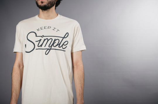 man wearing white shirt with text on front