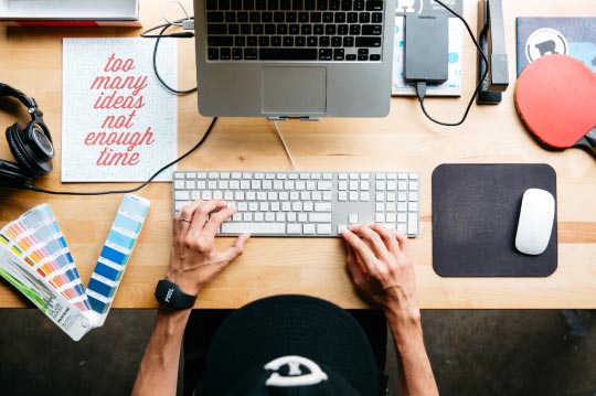 overview with man working on keyboard