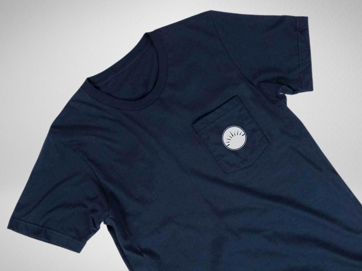 Navy pocket t-shirt with white circle logo against a white background