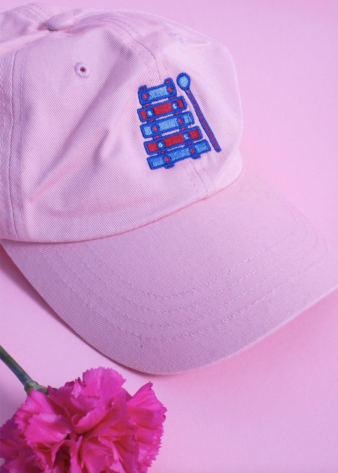 Light pink embroidered hat with a hot pink flower